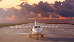 Private Jet on the runway at sunset. 7 Steps to Master In-House Jet Management Without the Chaos